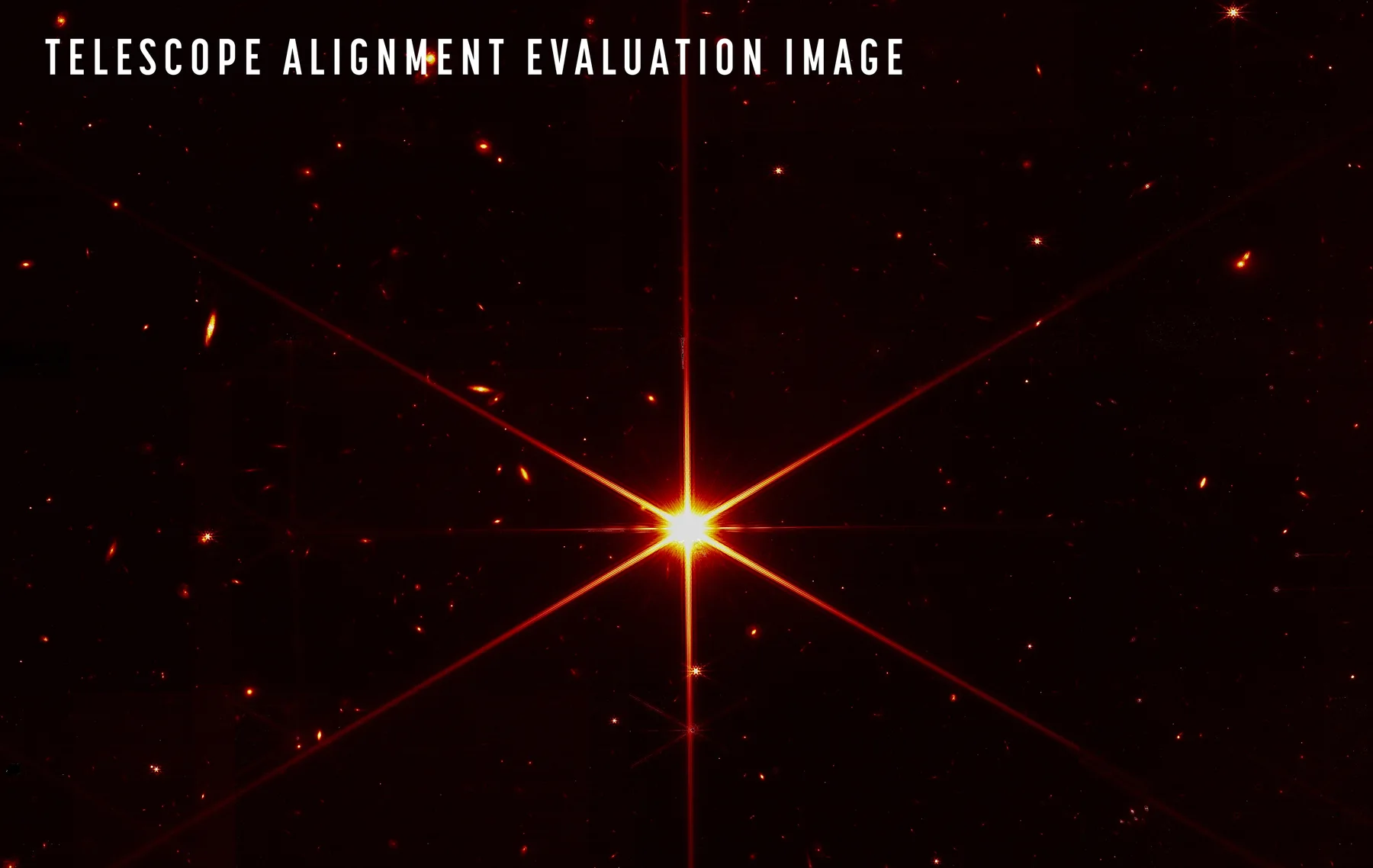 A bright star and distant galaxies photographed by the James Webb Space Telescope