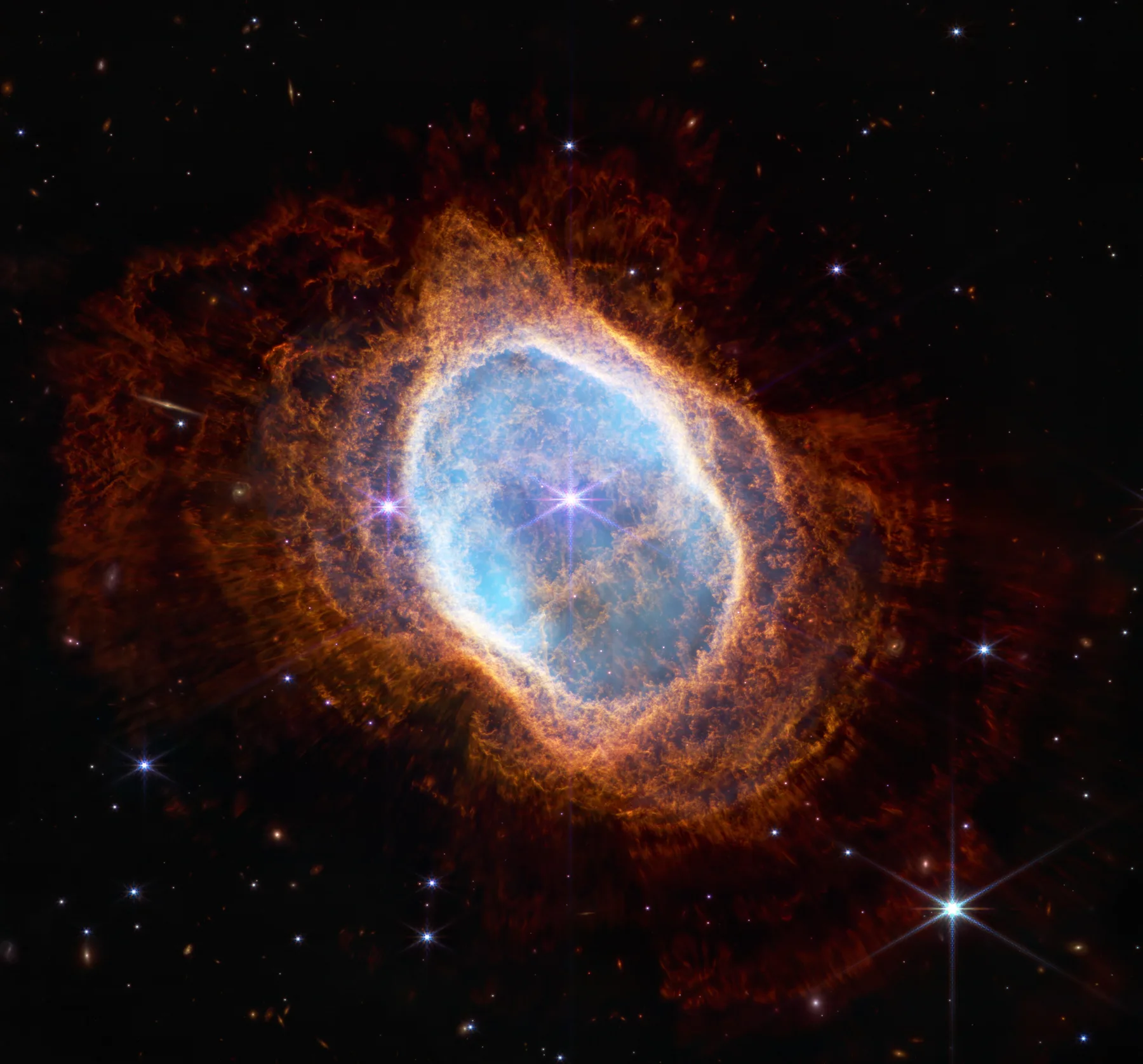 The Southern Ring Nebula with a blue centre and warm orange outer shell